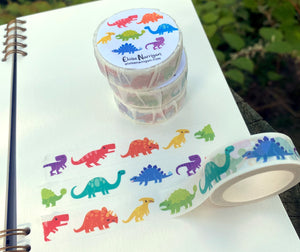 Decorative tape with white background with images of multicolored dinosaurs.