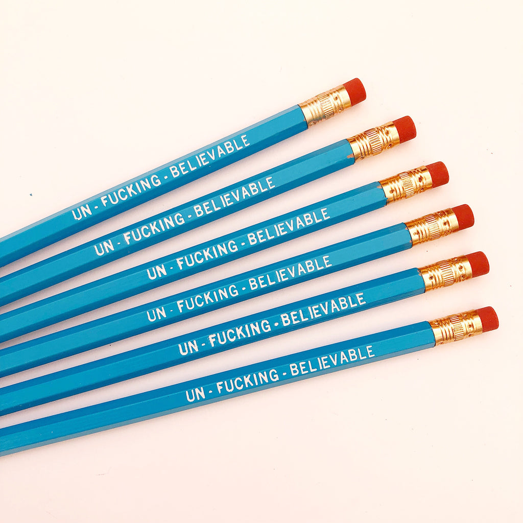 Image of blue pencils with white text says, "Un-fucking believable". 