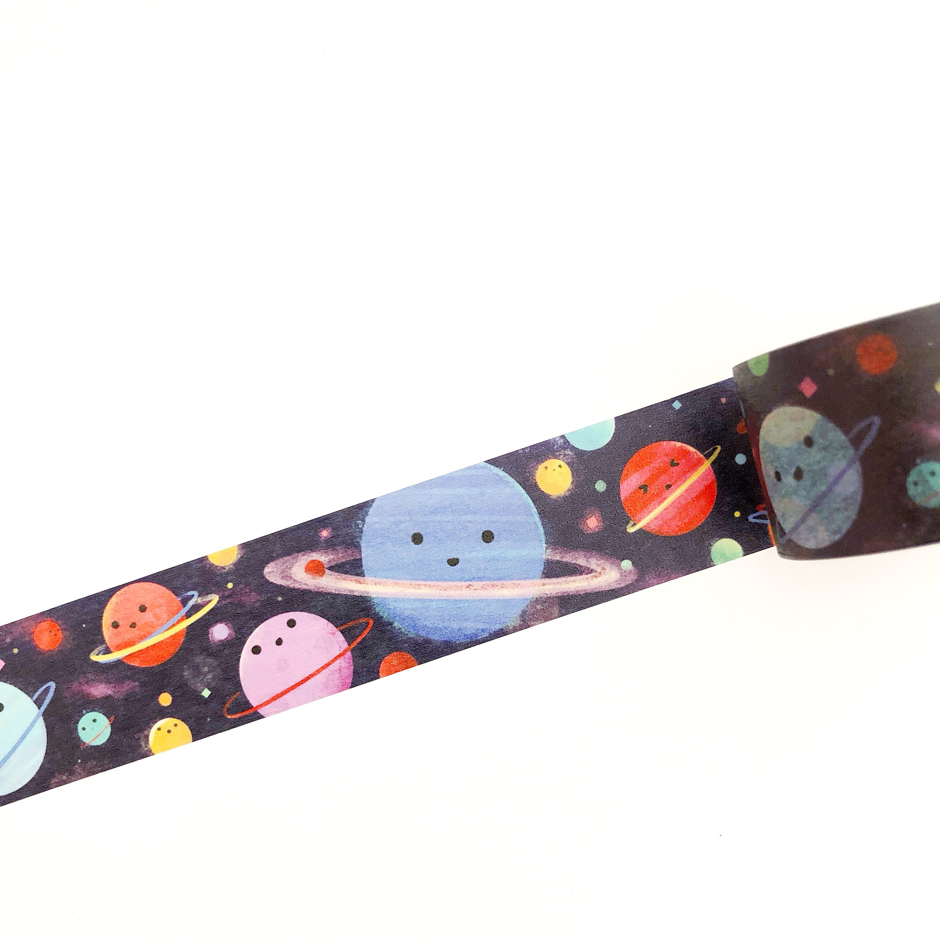 Black tape with images of outer space planets, moons and the galaxy in a repeating pattern.