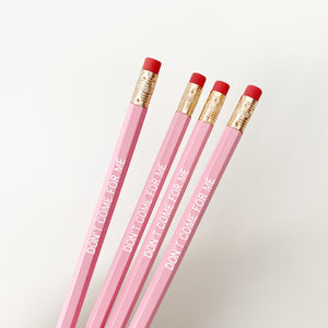 Pink pencils with white text says, "Don't come for me". 