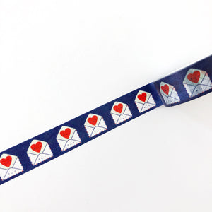 Decorative tape with dark blue background with images of white mailing envelopes with red hearts on the flaps.