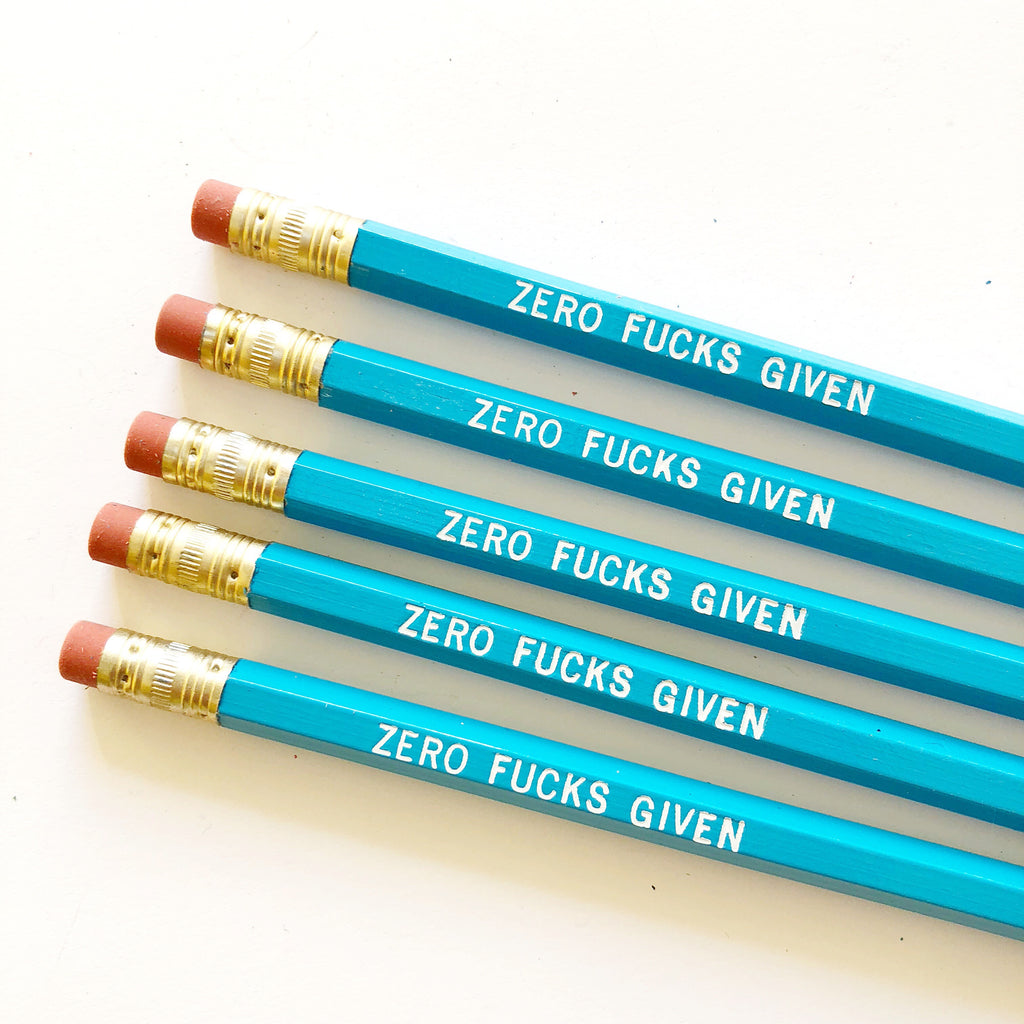Teal pencil with white text says, "Zero fucks given".