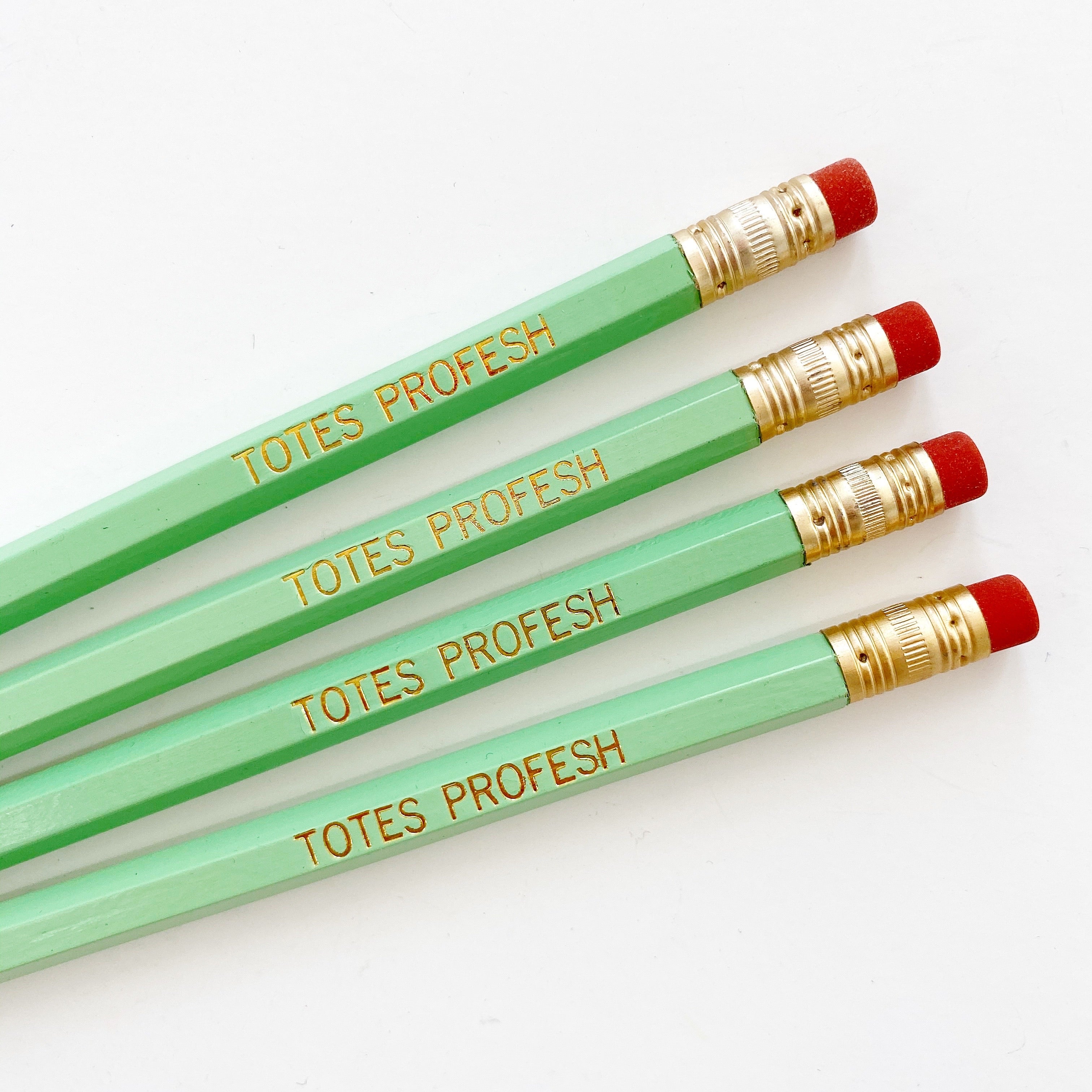 Image of green pencils with gold foil text says, "Totes profess". 