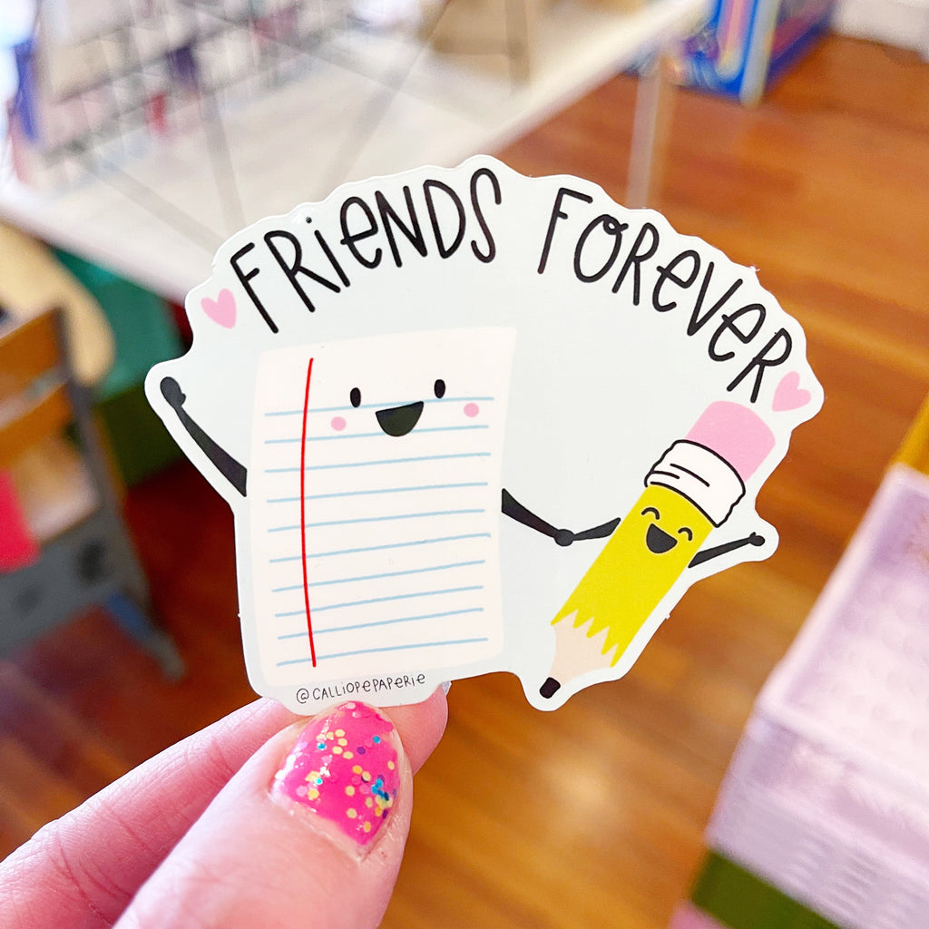 Image of sticker with sheet of notebook paper and pencil holding hands and black text says, "Friends forever". 