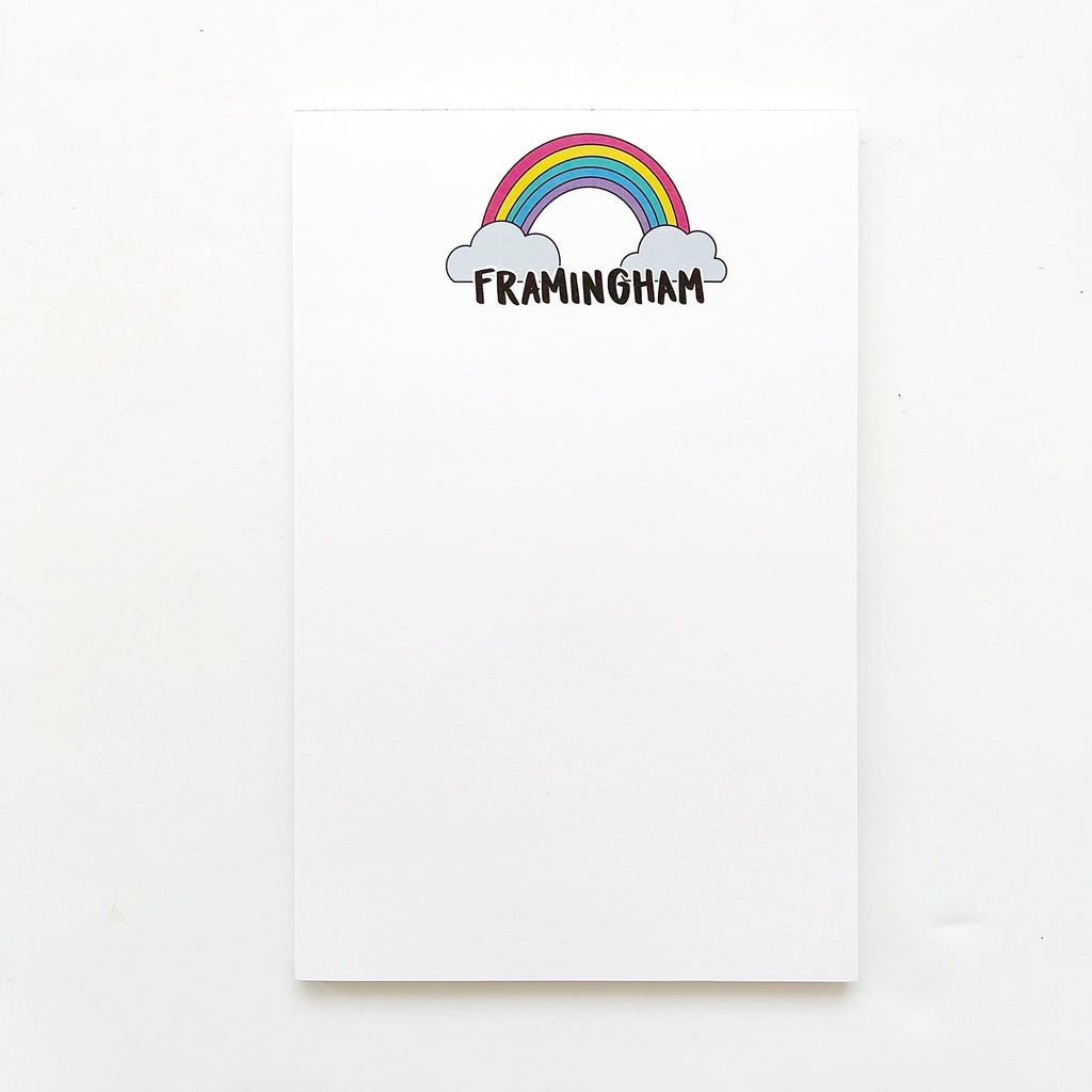 Image of notepad with white background and rainbow with clouds and black text says, "Framingham". 