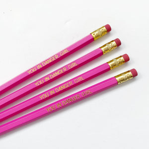 Image of pink pencil with gold foil text says, "You in danger, girl".