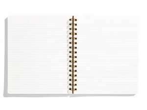 Image of opened notebook with ivory background and light blue lines. 